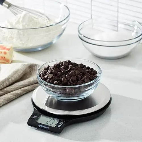 Digital Kitchen Scale With Large LCD Display And Tare Function Pro-Grade Measures In Pounds Ounces Grams Milliliters And Fluid Ounces Weighs Up To 11 Pounds Batteries Included Sleek Black And Stainless Steel with chocolate chips