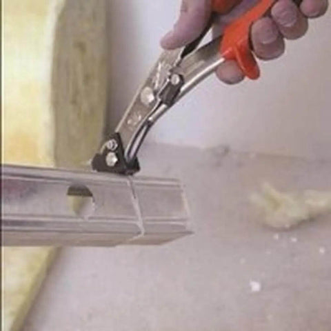 Close-up of NR1 Hand Nibbler with Built-In Waste Cutter cutting metal sheet, showing soft grip handles and precise nibbling action.