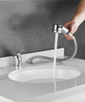 Person using Salon Shampoo Bowl Faucet Kit With Hose and Shower Spray Head for Backwash Units, chrome finish in bathroom sink.