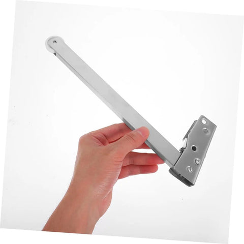 Rock Solid Heavy Duty Stainless Steel Automatic Fire Door Closer With Quick Release Sequencer And No Sweat Setup For Top Tier School Safety Along Tight Hallways held in hand.