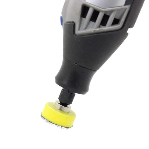 Rotary tool with 1-inch sanding disc mounted, part of 110 Piece 1 Inch Sanding Discs Set With 2 Mandrels And Hook And Loop Shank Pads 40 To 600 Grit Polishing Kit