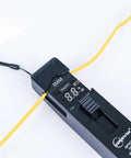 TFI-35 Pro Grade Optical Fiber Identifier With 4 Adapters for Bare Fiber Patch Cords and Ribbon Fiber in use, black.