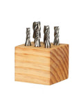 Five 4-flute high-speed steel end mills with 3/8 in. shanks in a wooden block holder