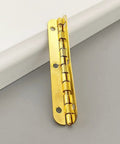 Slick 2 Pack Antique Gold Cabinet Hinges For Closets And Jewelry Boxes, Rock Solid 65Mm Heavy Duty Vintage Hardware, Badass Top Shelf Furniture Mounting Gear That Truly Slaps, single hinge close-up view.