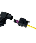 Straight Shot Ambient Air Temperature Sensor With Pigtail Wire Harness Direct Replacement For Cadillac Buick Gmc Trucks shown from side angle with connectors.