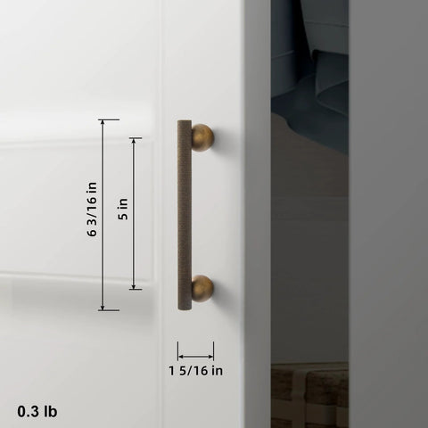 Side view of a Six Pack 5 Inch Knurled Antique Brass Bar Pull with round end mounts on a cabinet door.