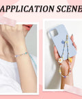 Woman wearing jewelry made with 200 Piece Billiard Ball Print Polymer Clay Beads Set on wrist and phone charm string.