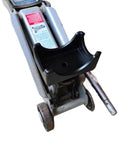 Close-up of a bottle jack with a black Bottle Jack Axle Saddle Adapter For 2 Inch And 3 Inch Axle Tubes attached, showing durable steel construction.