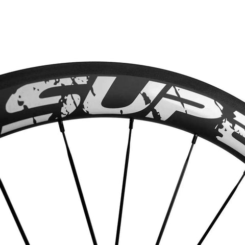 Close-up of Dual Depth 50 And 25mm UD Matte Finish 700C Carbon Wheelset Clincher showing rim detail and spokes.