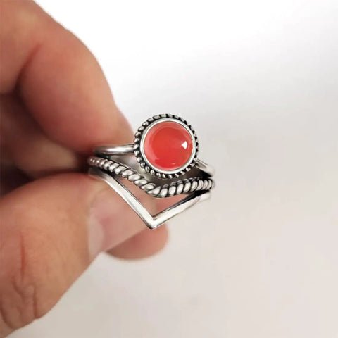 Red Agate Stone V Shape Chevron Ring In Retro Stainless Steel 8mm Wide Band With Natural Quartz Crystal Gem held in hand