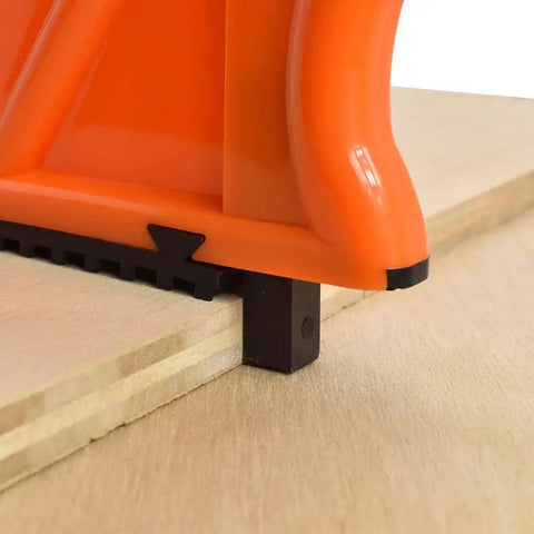 Close-up of Power Hands Push Stick for Woodworking on wooden surface, showing beefed up durable thick plastic design and non-slip grip.