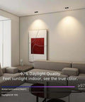 Dimmable Recessed LED Light Fixture With 2 Heads, white ceiling spotlight in a modern living room setting, illuminating artwork.