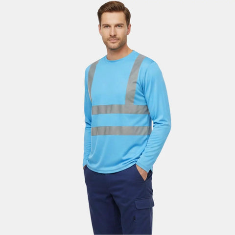 Heavy Duty Class Three High Visibility Long Sleeve Safety Shirt Loaded With Ansi Certified Reflective Tape Built Hella Tough For Your Daily Job Site Grind, light blue, worn by a man.