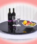 Smooth As Butter Black Tempered Glass Lazy Susan Turntable Built Different Heavy Duty Rotating Serving Tray For Dining Tables with wine and fruit.