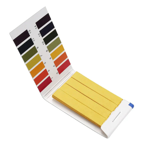 Open pack of pH Test Strips 1-14 Full Range 1200 Strips For Garden Soil Testing, showing litmus paper and color chart for matching.