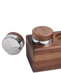 Professional Grade 304 Stainless Steel Espresso Coffee Distributor Featuring Three Angled Slopes To Ditch Clumps And Flatten Grounds For Tight Rock Solid Tamps Guaranteeing A Clean Smooth Shot Pull Across 51 53 58MM Filter Basket Sizes on wooden base.