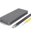 Built Tough 40Gbps M.2 NVMe SSD Enclosure With Sleek Aluminum Build And Internal Turbo Cooling Fan, includes tools for setup.