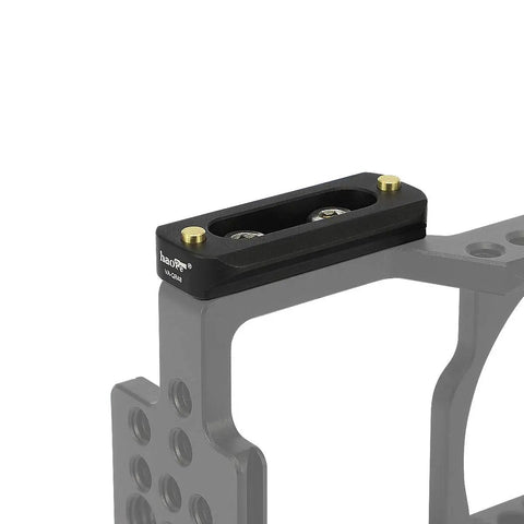 Heavy Duty Quick Release NATO Rail Plate With 1/4 20 Screws mounted on camera cage, featuring two gold locking pins.