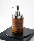 360 Degree Motorized Rotating Display Stand For Photography Products showcasing a wooden soap dispenser on a smooth black turntable.