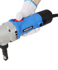 Pro Electric Sheet Metal Nibbler Cutter With Strong 500W Motor And 2000 RPM Speed for cutting steel, held in hand with glove.