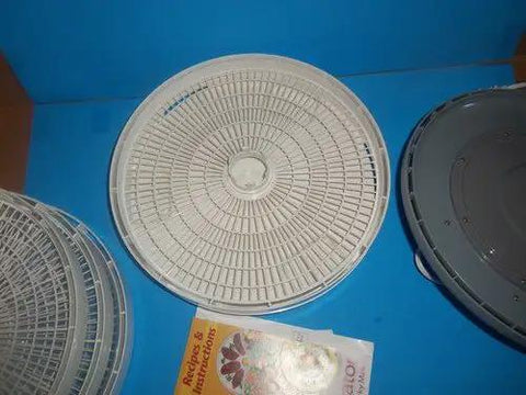 Empty stackable tray from Four Stackable Tray Food Dehydrator And Jerky Maker for homemade healthy snacks.