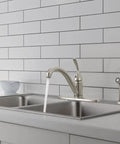 Classic Single Handle Kitchen Sink Faucet With Side Sprayer In Stainless Finish, 4 Hole 8 Inch Center Install shown in modern kitchen