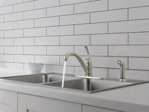 Classic Single Handle Kitchen Sink Faucet With Side Sprayer In Stainless Finish, 4 Hole 8 Inch Center Install shown in modern kitchen