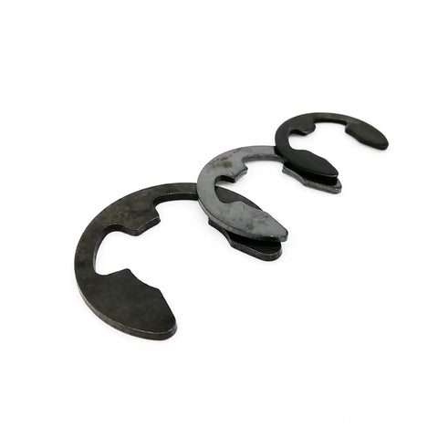 Close-up of black carbon steel circlips from External Retaining Ring Kit 580 Pcs And 1000 Pcs Set for M1.2 to M15 shafts.