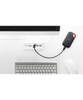 1TB Extreme Pro Portable SSD connected to computer, USB-C cable visible, rugged aluminum build, IP65 water and dust resistant