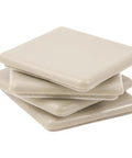 Stack of beige Two And A Half Inch Self Stick Square Furniture Sliders For Carpet And Hard Surfaces Anti Slip Adhesive Moving Pads