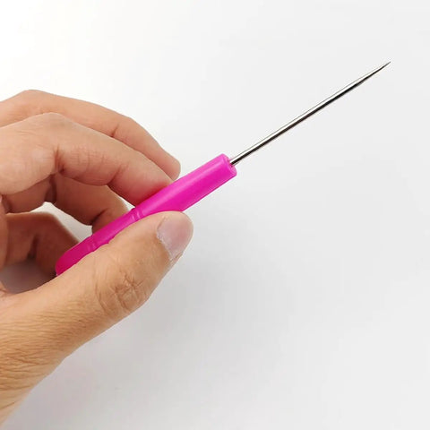 Pro Grade 36 Piece Scriber Needle Kit For Cake Decorating Featuring Stainless Steel Tips And Colorful Plastic Grips, sharp needle in hand.
