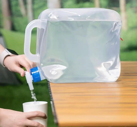 Collapsible 1.3 Gallon Water Container Two Pack BPA Free Camping Water Jug dispensing water into a cup outdoors