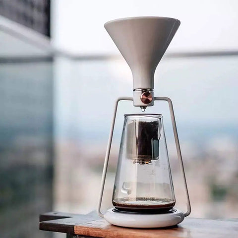Elevate Your Daily Grind With This Dope 3-In-1 Coffee Kettle, Cold Brew And Ice Drip Maker, Manual Filter Teapot For Smooth Lattes And Cappuccinos, Matte Black Finish, glass kettle with white funnel top.
