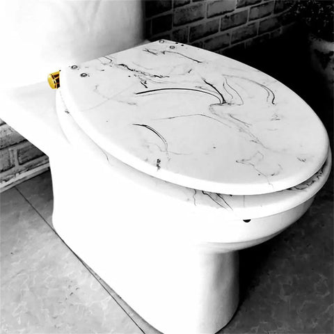 Universal Slow Close Toilet Seat With Authentic Marble Texture Crafted From Tough Urea Resin Soft Buffer Hinges on a toilet.