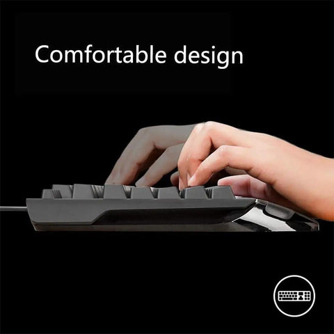 The Beast Mode Full Size Mechanical Gaming Keyboard Delivering Snappy Keystrokes With Dynamic Rainbow Backlight, Flexible Macro Configuration, Comfy Ergonomic Profile, Tough Braided Cable And Hassle Free Wired Setup For Your Daily Grind Gaming Rig with hands typing.