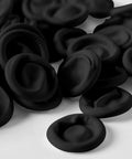 Ace Every Shift With This 400 Pack Black Latex Finger Cots Kit Featuring roll on fingertip guards on a white surface.