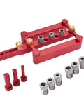 Heavy Duty Self Centering Dowel Jig Setup With Fast Grip Positioner Locator, red aluminum with various pin sizes for precise woodworking.