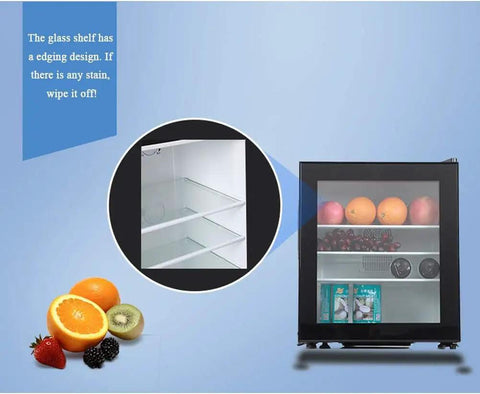 Compact Upright Mini Freezer Featuring A Sleek Black Glass Door With Energy Efficient Cooling That Runs Dead Quiet At Twenty Eight Decibels Ideal For Dorms Offices Or Small Bedrooms With Plug And Play Design showcasing the glass shelves and fruits inside.