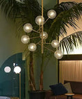 Modern Glass Pendant Ceiling Light Hella Sleek Chrome Body Six Head Glass Bubble Design Cold White Glow Total Flex For Living Room Bar above indoor plants.