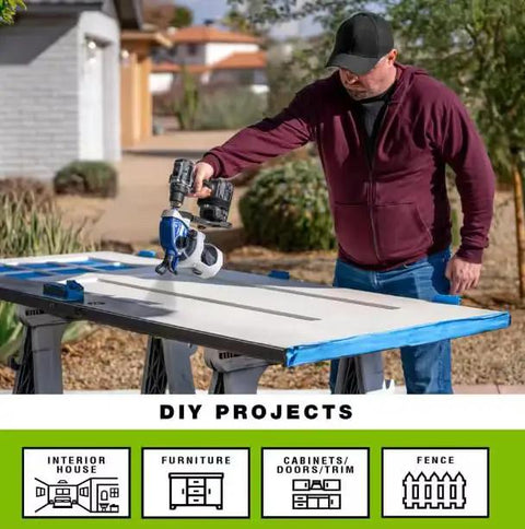 Man using Portable Cordless Drill Connect Paint Sprayer Featuring A Compact Application Cup And High Pressure Output on a work table.
