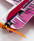Close-up of Sakura EPP Foam RC Plane Kit 420mm Wingspan Rad Aerobatic Beast pink wing with orange propeller detail