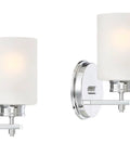 Kira Home Phoebe 8" Modern Industrial Wall Sconce for Bathroom Vanity, Pack of 2, chrome finish with bubble glass shades.