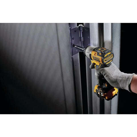 Xtreme 12V Max Cordless Impact Driver with 1 Quarter Inch Hex Chuck in use fastening a hinge on a metal door