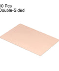 Image showing Double Sided FR4 Copper Clad PCB Boards 100 X 70 mm 0.8 mm Thick 10 Pack for DIY electronics and prototyping.