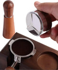 Professional Grade 304 Stainless Steel Espresso Coffee Distributor Featuring Three Angled Slopes To Ditch Clumps And Flatten Grounds For Tight Rock Solid Tamps Guaranteeing A Clean Smooth Shot Pull Across 51 53 58MM Filter Basket Sizes being held above a portafilter.