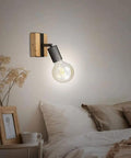 Slick Adjustable Metal And Wood Wall Sconce Vintage Industrial Farmhouse Light No Hassle Mount For Hallway Bedroom Stairs Heavy Duty Frame with warm light in cozy bedroom.