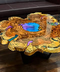 Wooden river table with vibrant resin inlay on a polished slab, showcasing natural wood grain and blue resin accents in a living room.