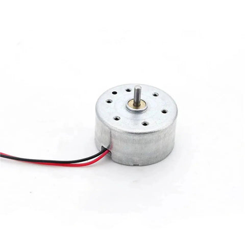 6V 6500 RPM Micro DC Electric Motor With A Tough As A Nail Build And Silky Smooth Spin Designed For Smart Locks Mini Fans And DIY Crafts Offering No Fuss Reliability Daily And Long Term Durability, side view with exposed wires.
