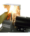 Heavy Duty 7 Inch Arc Lawnmower Blade Bench Grinder With Half Horsepower Motor working with sparks flying.