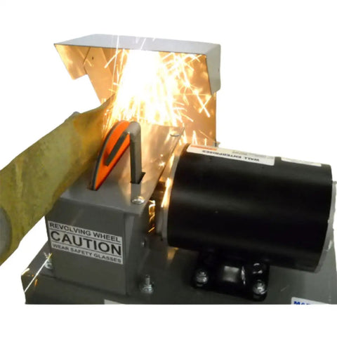Heavy Duty 7 Inch Arc Lawnmower Blade Bench Grinder With Half Horsepower Motor working with sparks flying.